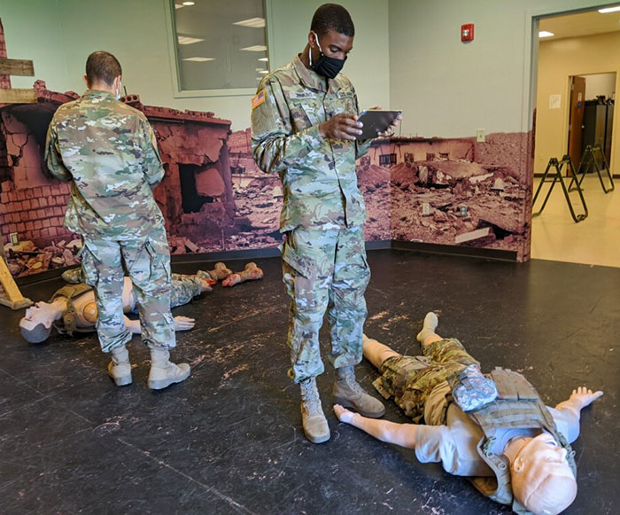 Army Soldiers use the tablet version of the AUGMED 