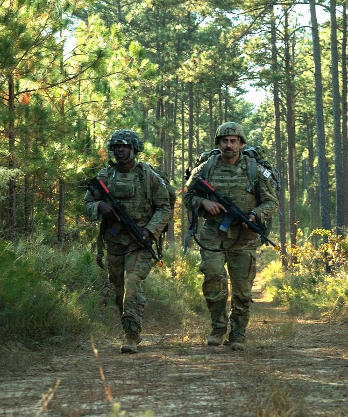 Staff Sgt. Chimaobi Umeh (left) of the U.S. Army Medical Research Institute of Infectious Diseases, participates in a ruck march with his teammate, Sgt. 1st Class Justin Montoya of the Moncrief Army Health Clinic, during the 2023 Medical Readiness Command-East and U.S. Medical Research and Development Command Best Medic Competition, which took place at Fort Eisenhower, Georgia, Nov. 5-8, 2023. (photo credit: MRC-E Public Affairs Office)
