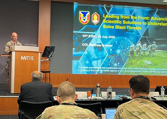 Colonel Matthew Scherer at a lecturn