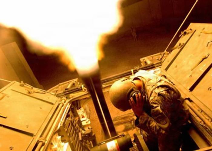 soldier firing a mortar