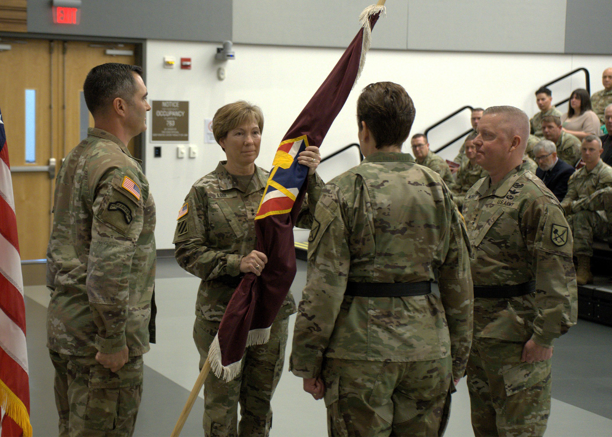 Maj. Gen. Paula Lodi passes the colors