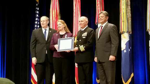 Dr. Mary Ann Spott is presented the Distinguished Civilian Service Award