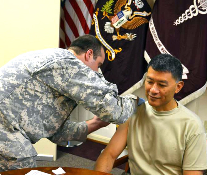 USAMRMC and Fort Detrick Commander Brig. Gen. Joseph Caravalho Jr. received his flu vaccine shot Oct. 7.
