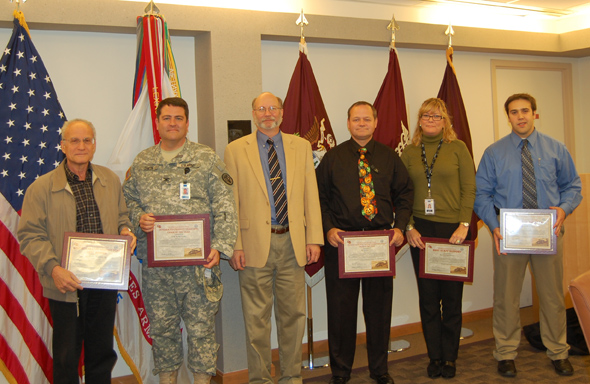 Dr. Kenneth Bertram presents certificates to Decision Gate 2012 award winners