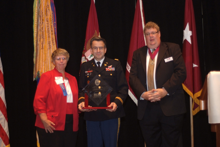 Col. Dallas Hack (center), director of the USAMRMC CCCRP, accepts the 2012 Maj. Jonathan Letterman Award for Medical Excellence
