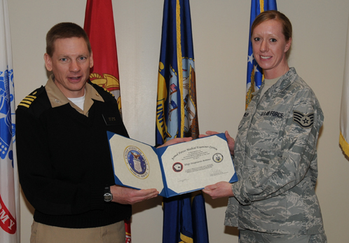 Air Force Staff Sgt. Stephanie Ambler receives certificate