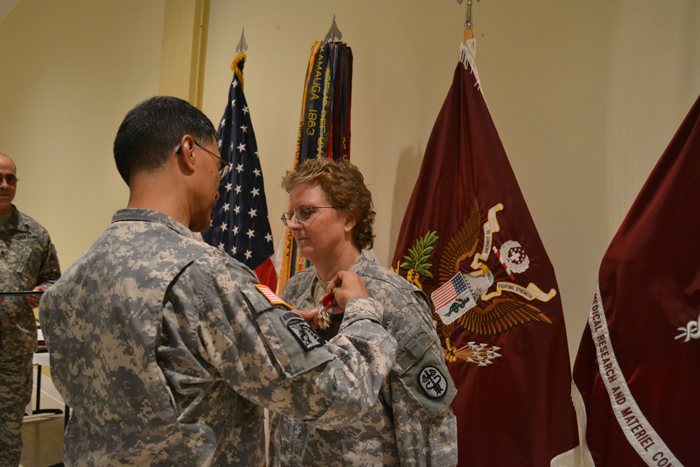 Maj. Gen. Joseph Caravalho Jr. pins Lt. Col. Jamie A. Blow