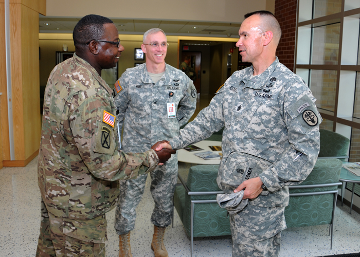 Sgt. Maj. James L. Devine welcomes Command Sgt. Maj. Gerald C. Ecker