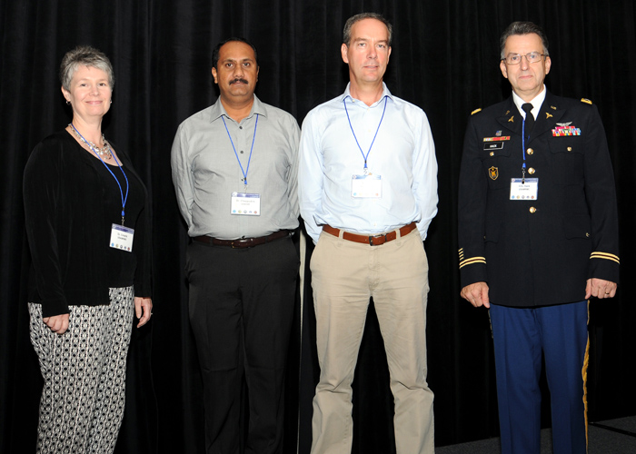 Col. Dallas Hack (right) stands with winners of the 2013 MHSRS poster awards