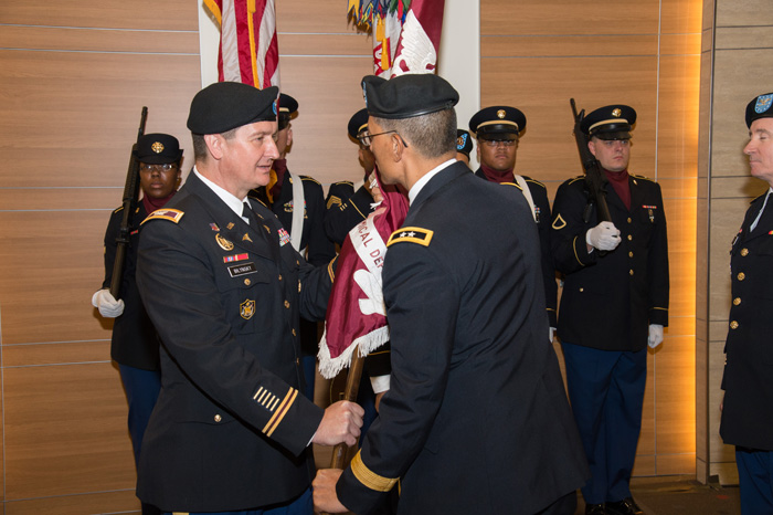 Col. Roman O. Bilynsky accepts the USAMRICD colors from Maj. Gen. Joseph Caravalho Jr.
