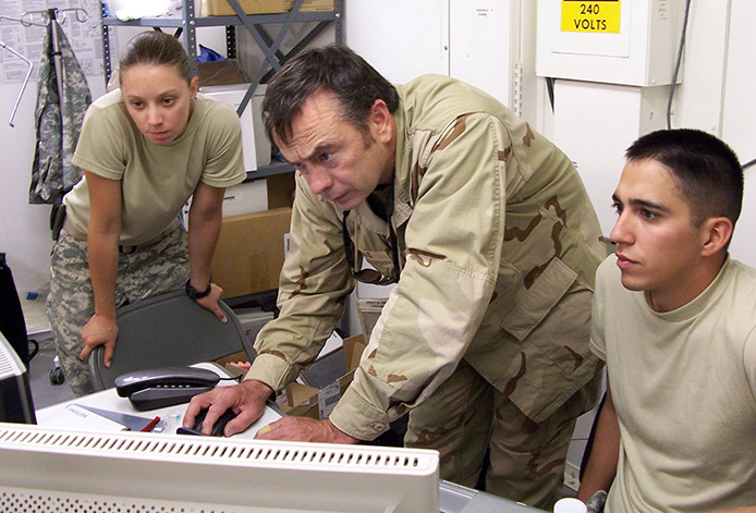 USAMMA Electronic Technician Mark Mills works on Army medical equipment in the field