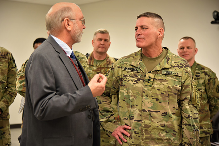 Lt. Gen. Paul A. Ostrowski speaks with Dr. Kenneth Bertram