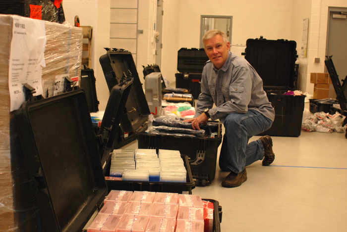 Dr. Randal Schoepp of the USAMRIID inspects packing cases