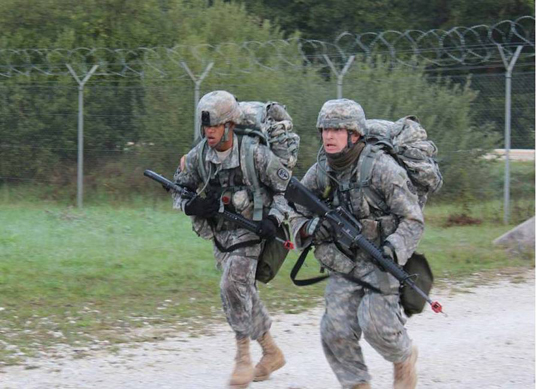 Sgt. Anthony Coleman (left) and Sgt. Jason Roth of the USAMMCE participated in the Expert Field Medical Badge competition at Grafenwoehr, Germany.