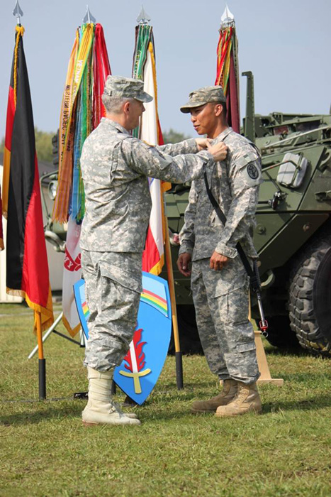 Lt. Gen. Donald M. Campbell Jr. awards Sgt. JoJo D. Ada the Expert Field Medical Badge