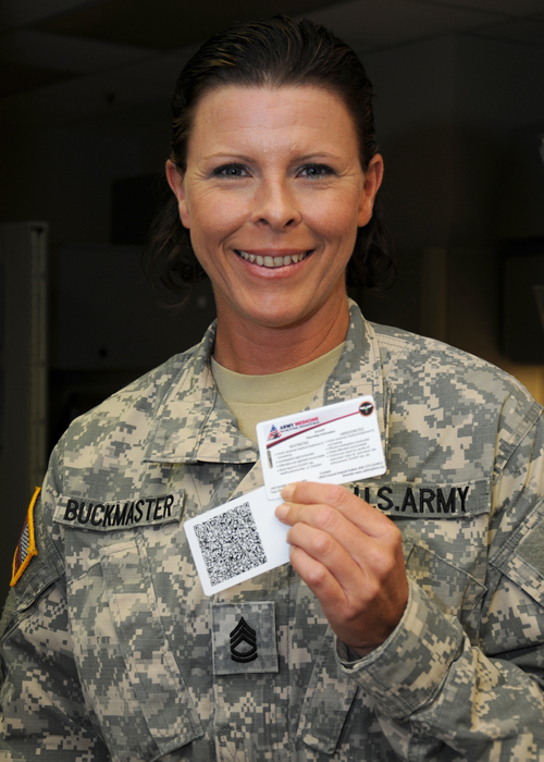 Sgt. 1st Class Erika Buckmaster holds SHARP information cards