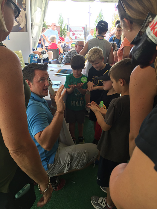 Michael Sandridge speaks with kids at the Great Frederick Fair