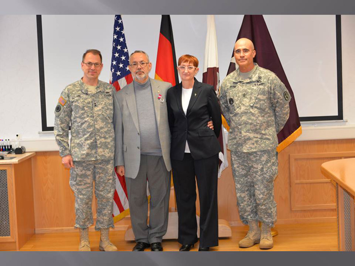 Maj. Gen. Brian C. Lein presented a retirement certificate and award to Luis DeAndrade