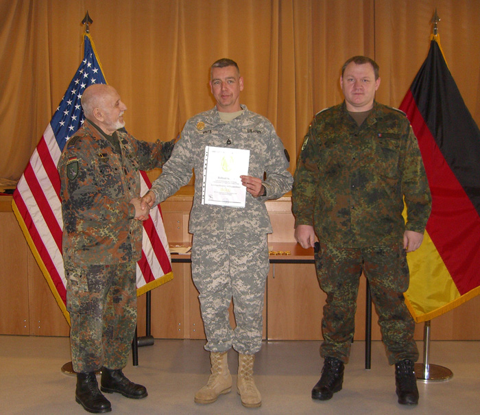Sgt. 1st Class Robert White of the U.S. Army Medical Materiel Center, Europe, receives his certificate