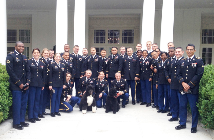 Soldiers from the USAMRICD and USACEHR pose in front of the East Wing