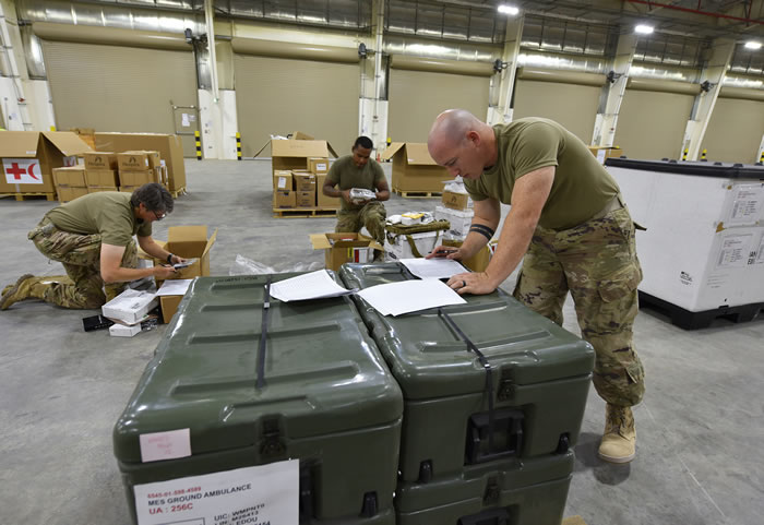Soldiers review inventory forms