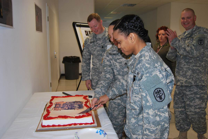 USAMMCE's Staff Sgt. Chemika Duckett and Pfc. Stephanie Bridgeforth cut cake