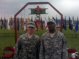 (From left) Spc. Matthew Young, 68K, U.S. Army Institute of Surgical Research and Spc. Antoine Brisson, 68K,  Company C, Brooke Army Medical Center, after receiving the EFMB at a ceremony at Camp Bullis, Texas April 2.