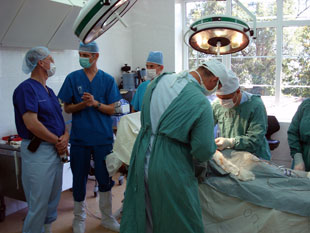 Dr. Evan Renz (left) confers with burn surgeons at the Republican Trauma