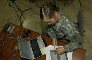 Soldier working at computer