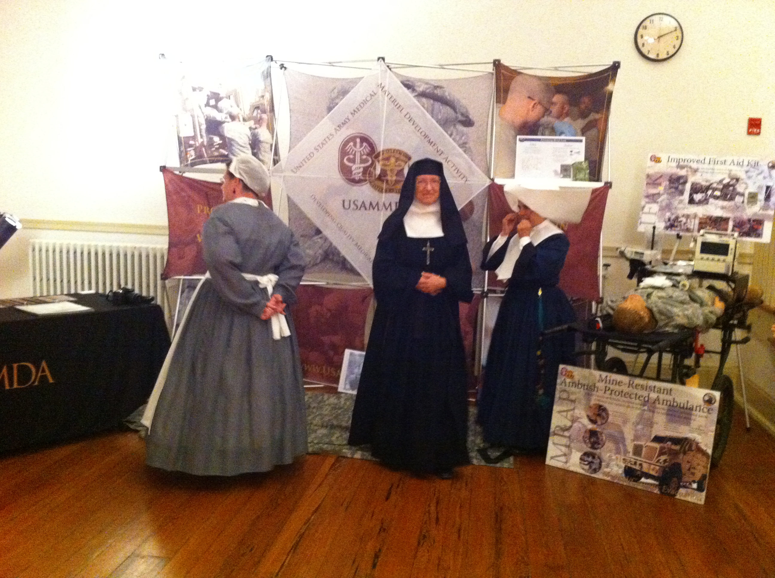 Sisters of Charity re-enactors visit the USAMMDA exhibit