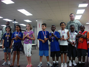 The Fort Detrick youth-10 soccer team receives their medals. They won 7 out of 8 games